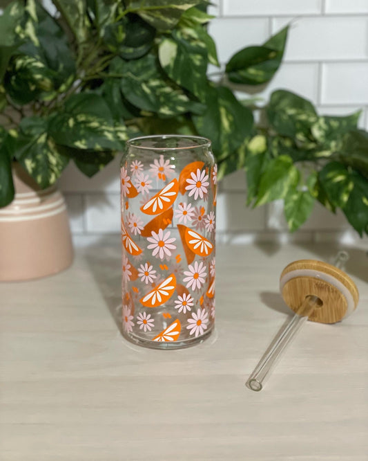 Oranges and daisy cup